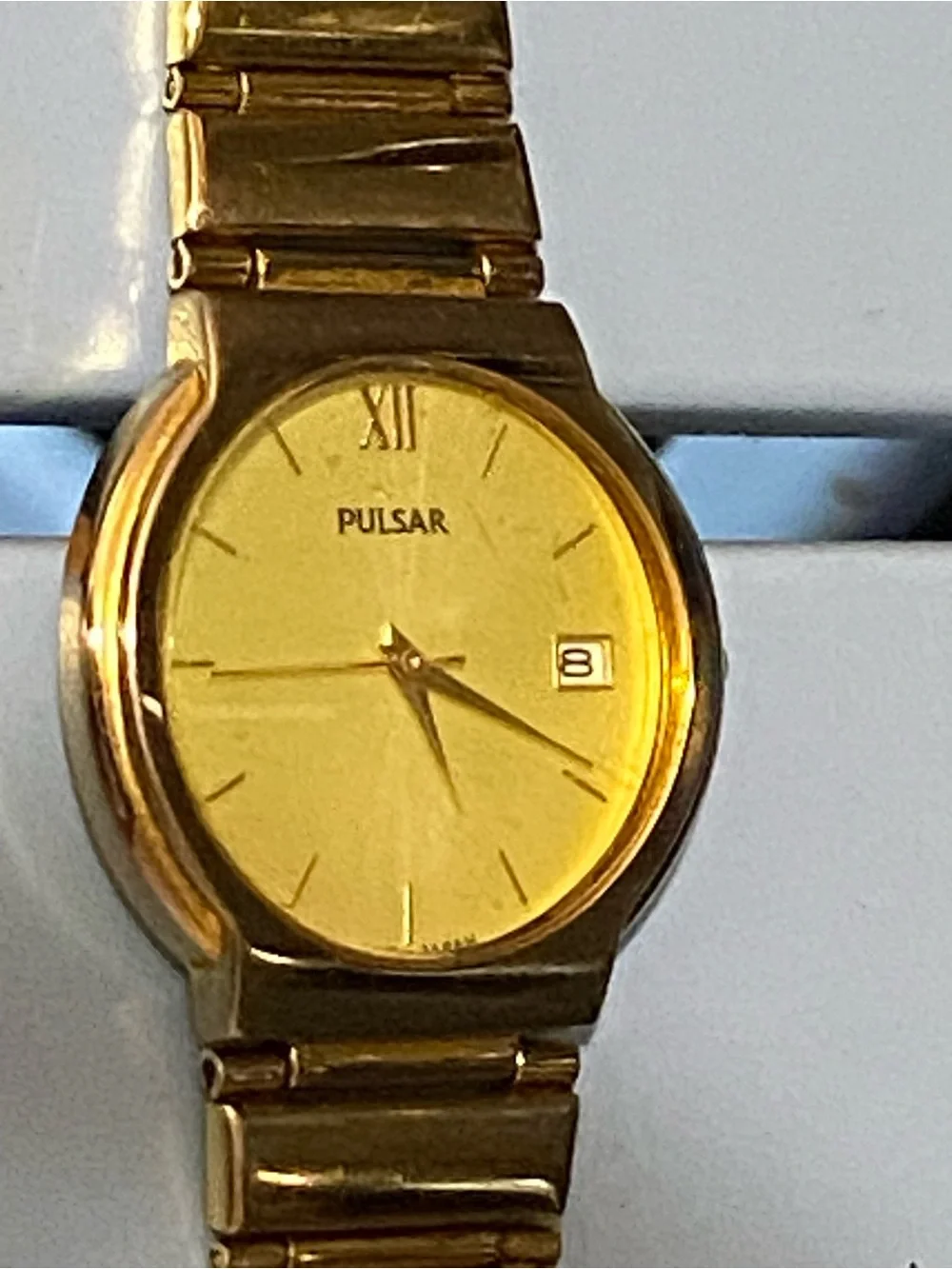 Pulsar Gold Watch Gold watch with gold dial, gold bracelet, and gold